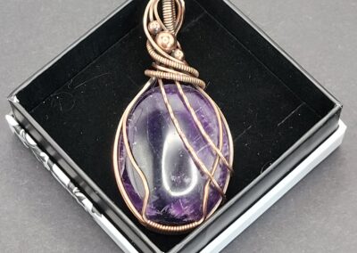 Wire-wrapped amethyst pendant by Renae Meyer in a gift box