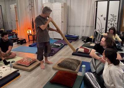 Alejandro Fuentes playing a didgeridoo