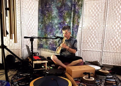 Alejandro Fuentes playing a wooden flute