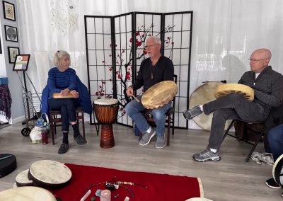 Scott Nelson leading a drumming circle outdoors